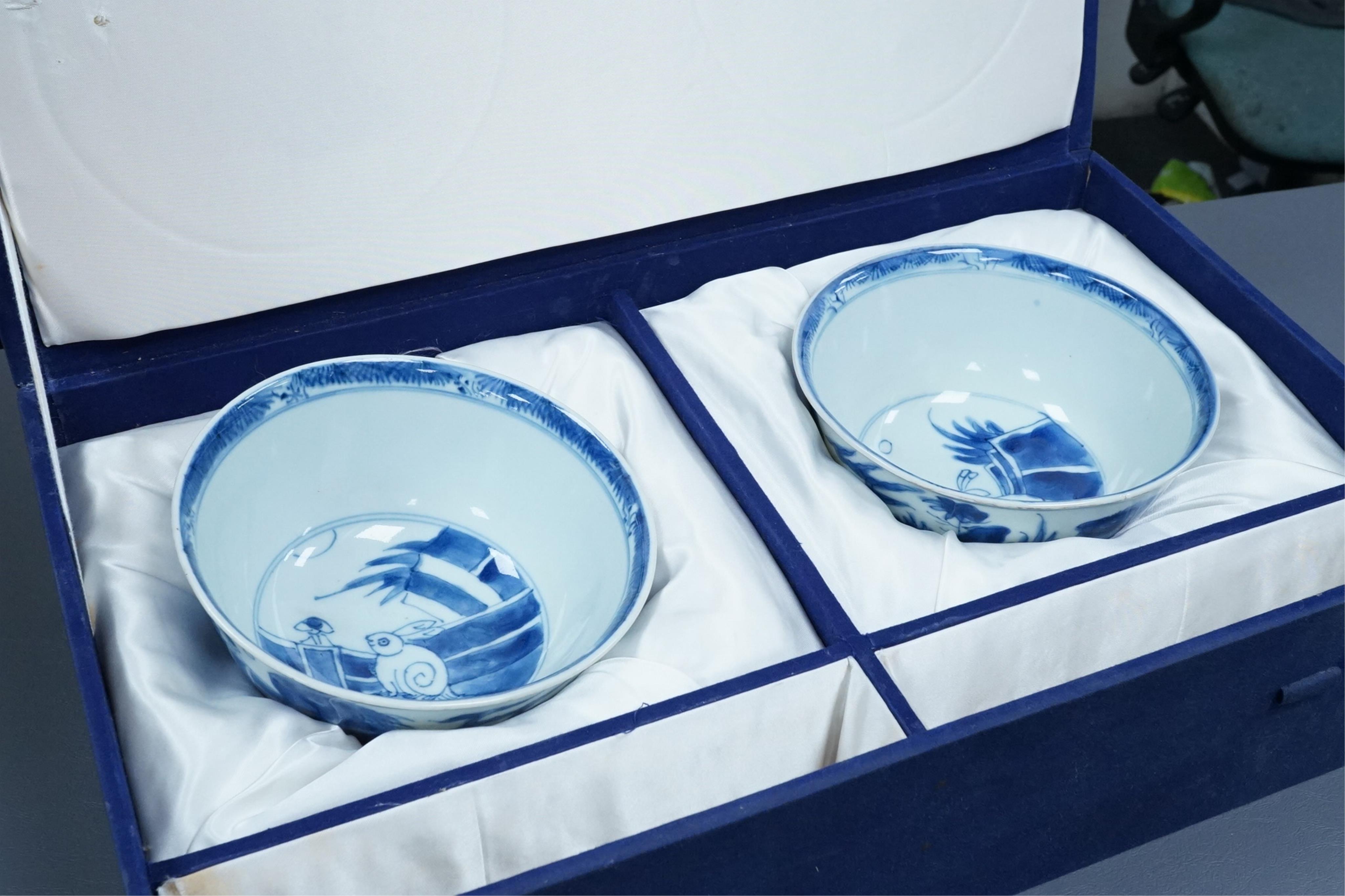 A pair of Chinese Transitional blue and white 'mythical beasts' bowls, early Kangxi period